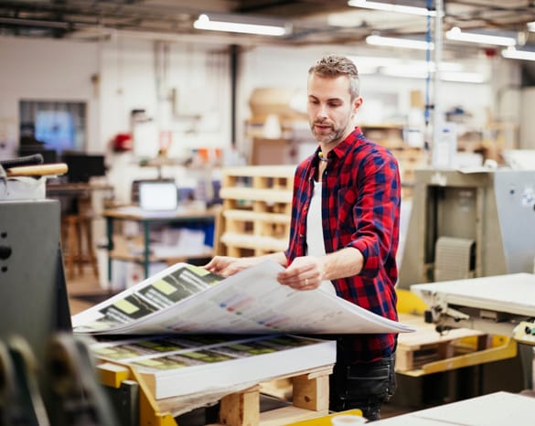 Printing guy looking at a print run