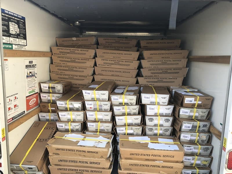 Stacks of mailers in a truck
