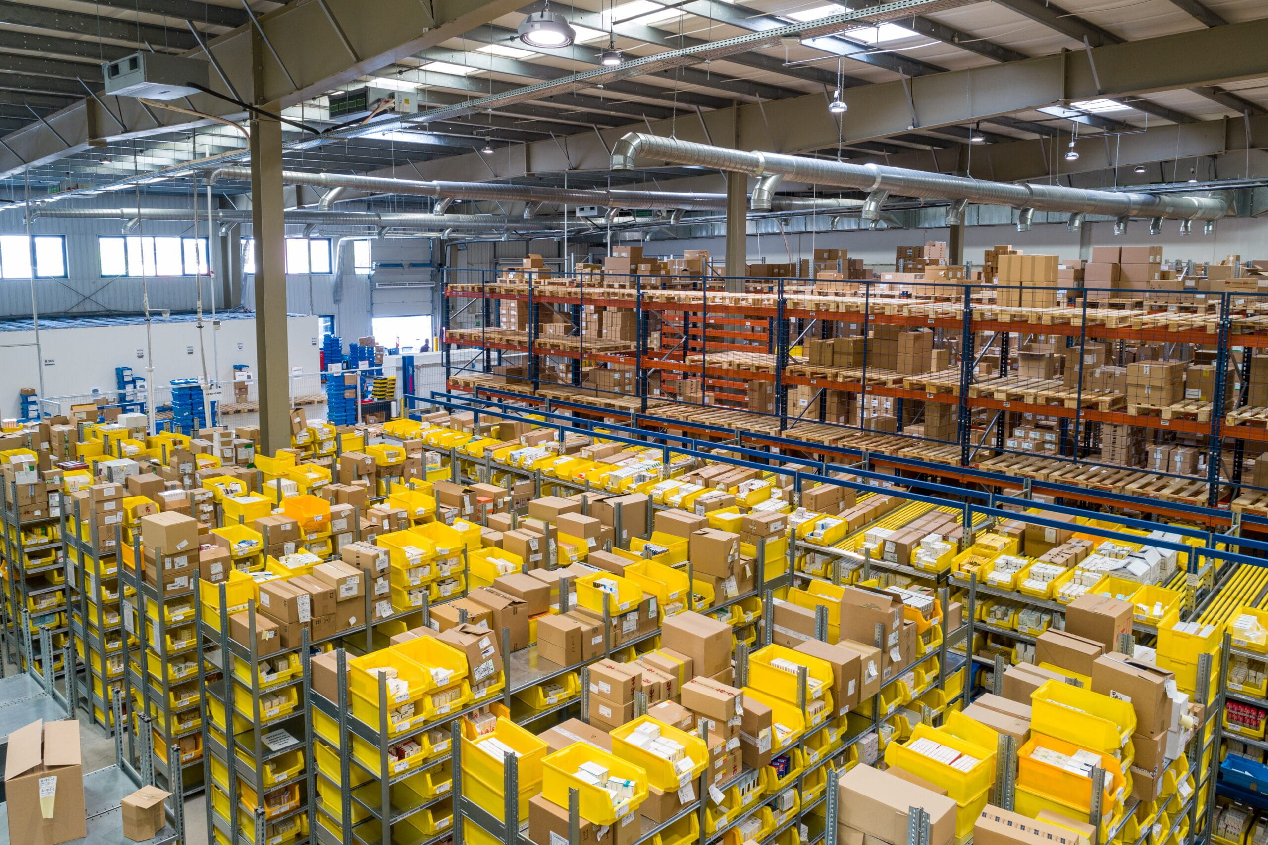 An overhead shot of a filled warehouse in action