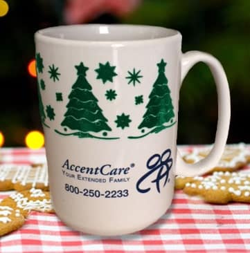 A christmas mug with a business name and information on it.
