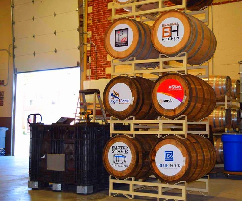 Beer Kegs with logos on the end of the casks